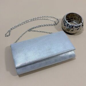 Silver sparkle coloured evening purse with chunky silver coloured bracelet‌